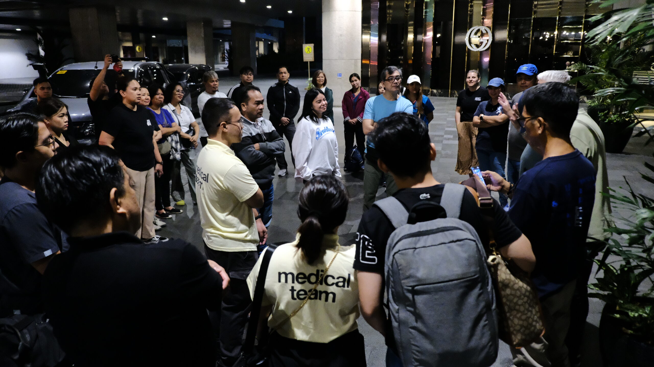 Volunteer huddle at Shangri-La Plaza